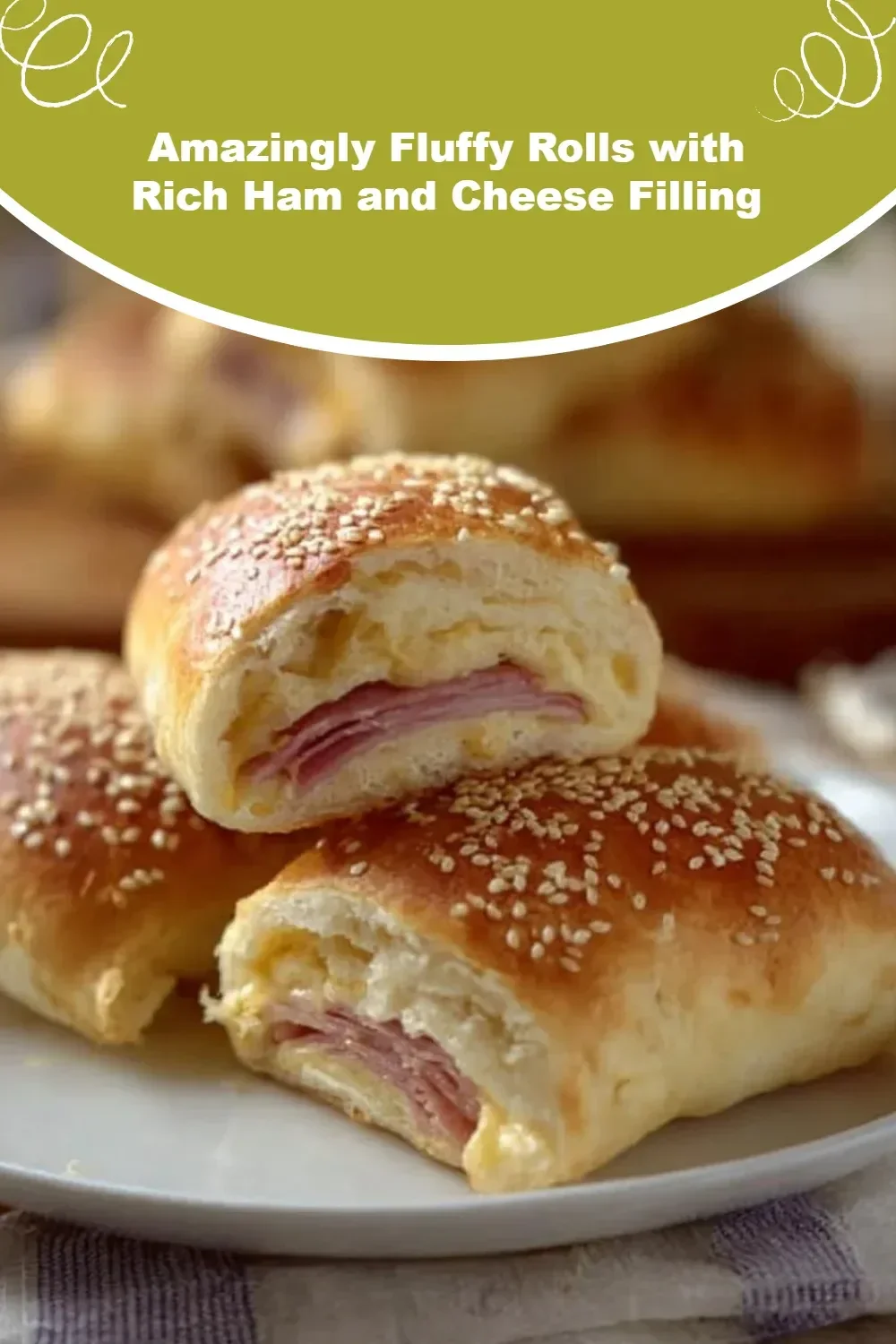 Fluffy rolls with ham and cheese filling, freshly baked and golden brown.
