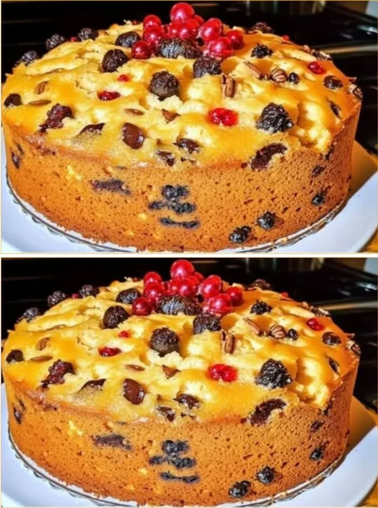 Delicious Christmas fruitcake garnished with dried fruits and nuts