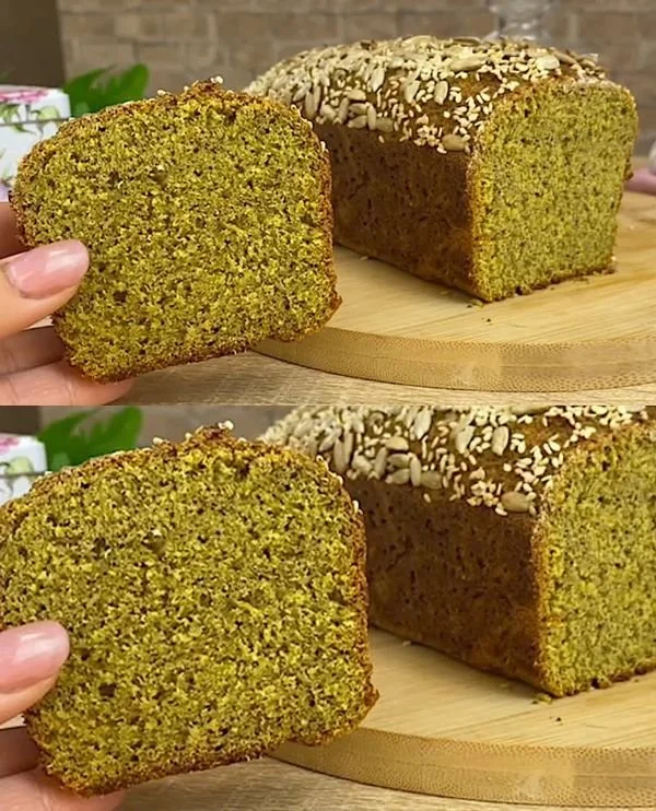 Healthy lentil bread loaf with fresh ingredients on a wooden cutting board.