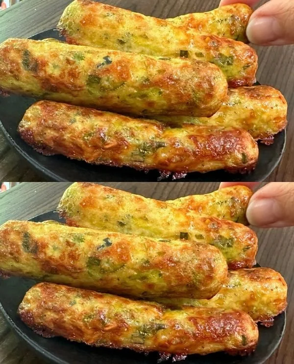Baked Zucchini Oatmeal in a dish, topped with nuts and served with a spoon
