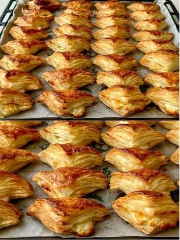 Delicious cheese pastries fresh out of the oven, golden and flaky.