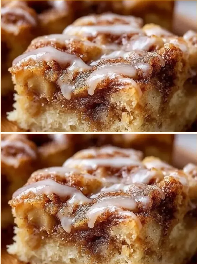 Slice of easy cinnamon apple cake topped with icing on a wooden table
