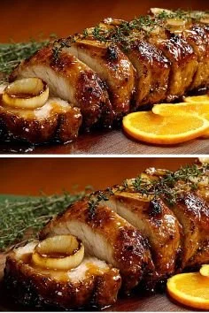 Deliciously juicy glazed meat served on a plate with vibrant garnishes.