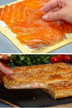 Smoked salmon puff pastry appetizer garnished with dill and lemon.