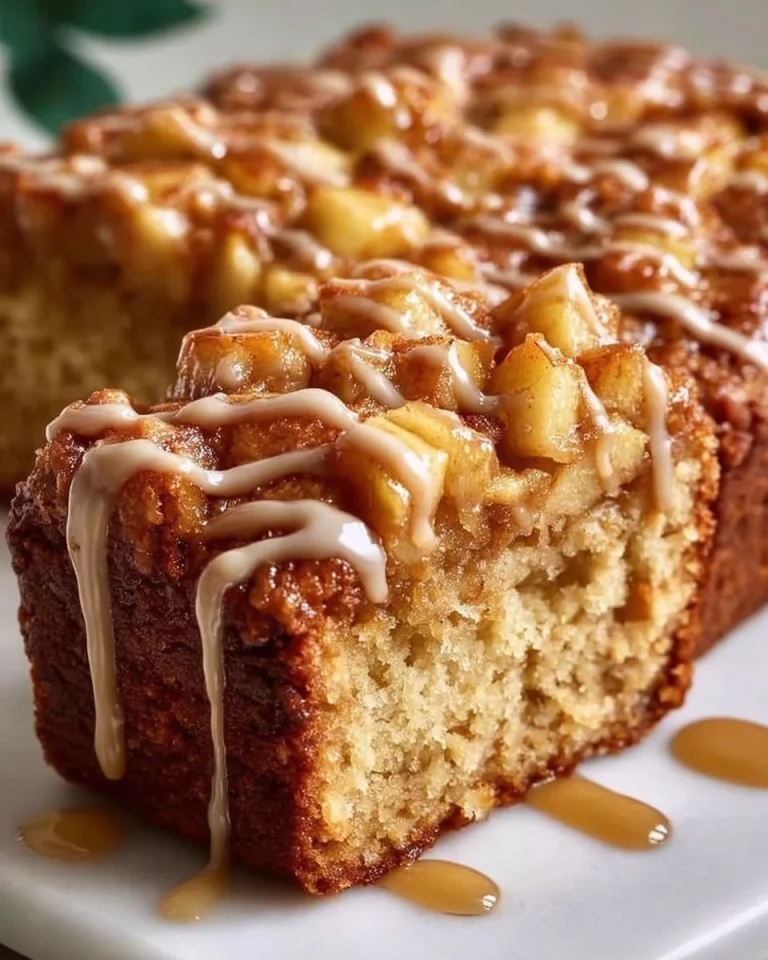 Delicious spiced apple coffee cake served on a plate