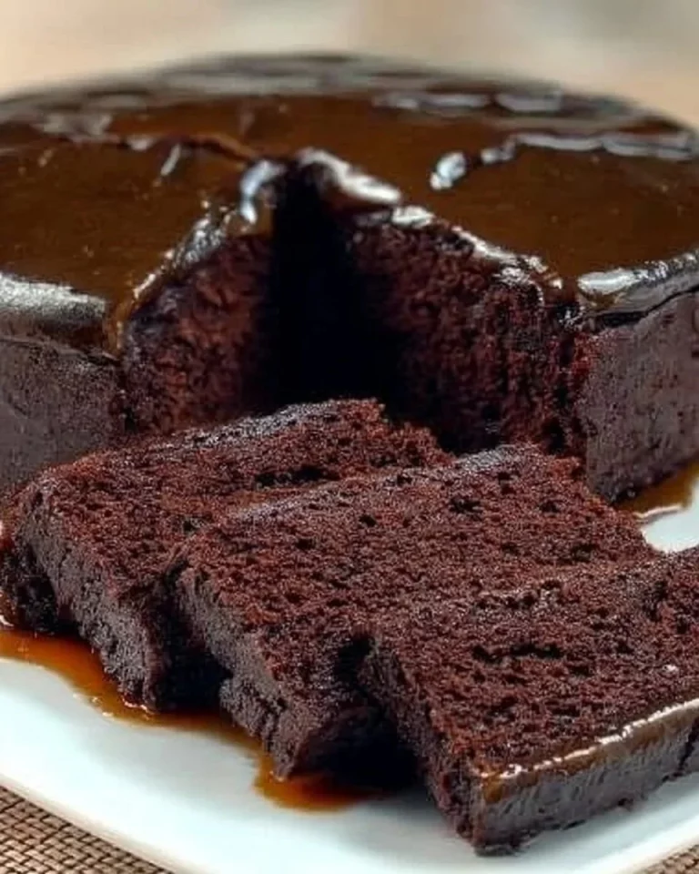 Sugar and flour-free chocolate cake topped with cacao and berries.