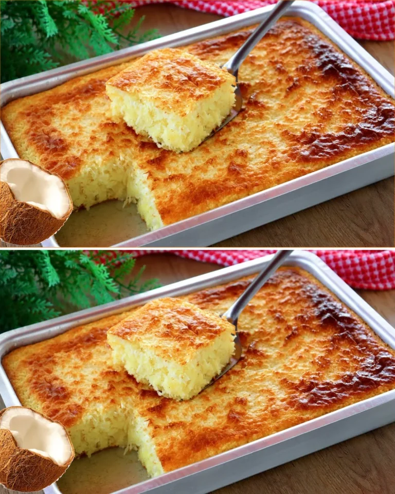 Wheat-free Coconut Cake served on a plate with a coconut garnish