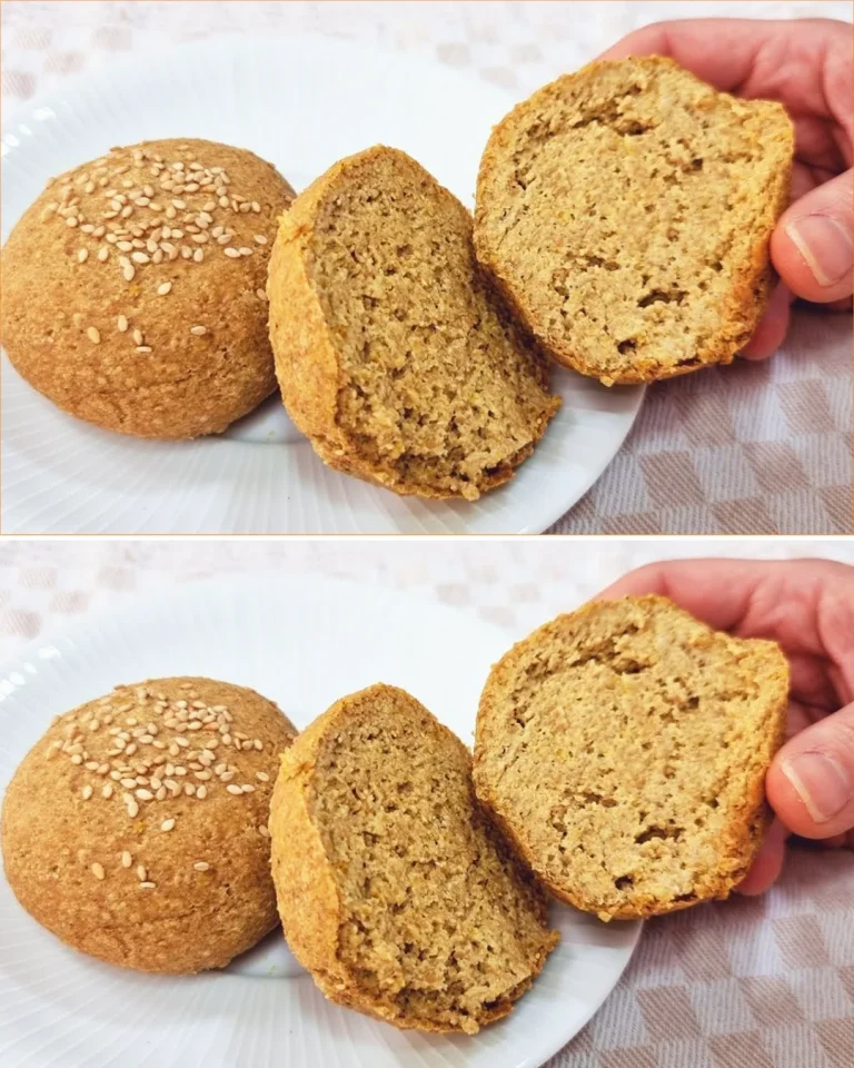 Fluffy low-carb bread slice on a cutting board with herbs