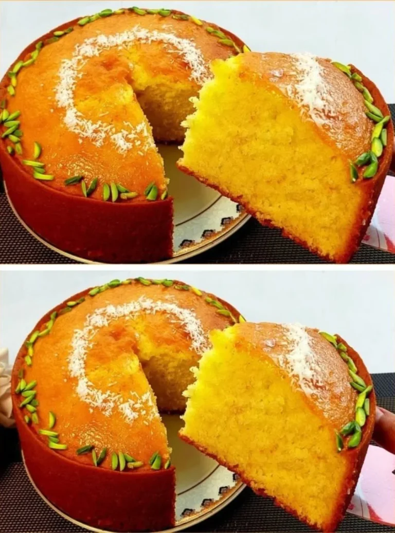 Delicious slice of orange cake topped with fresh oranges and cream