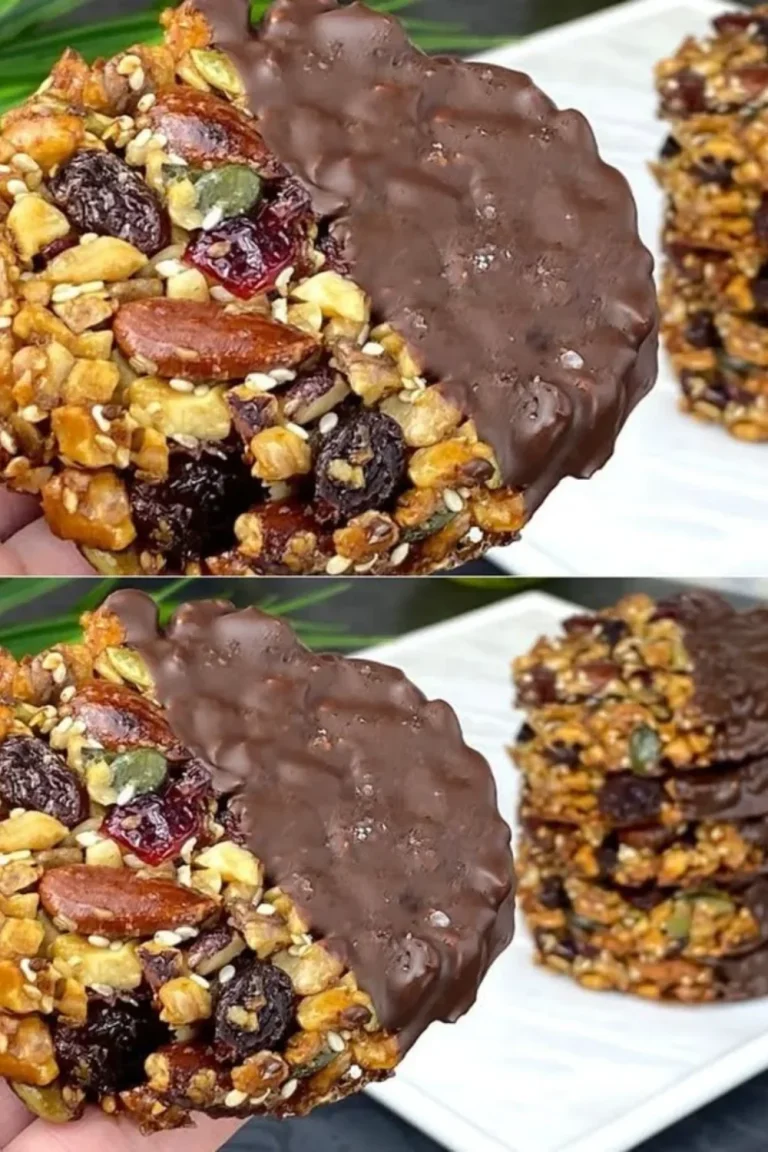 Chocolate dipped nut and seed cookies on a baking tray