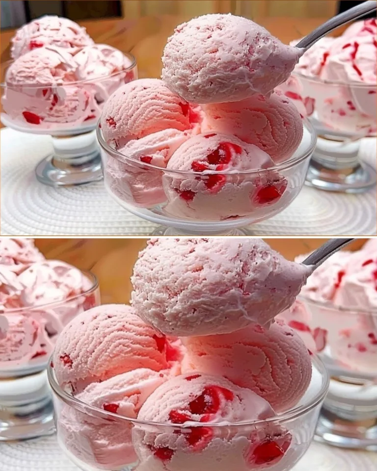 Bowl of creamy strawberry ice cream with fresh strawberries on top