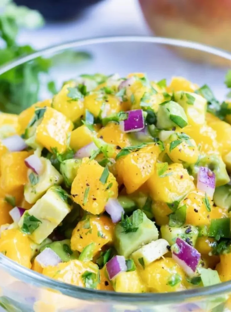 Delicious Mango Avocado Salsa served in a bowl, showcasing fresh ingredients.