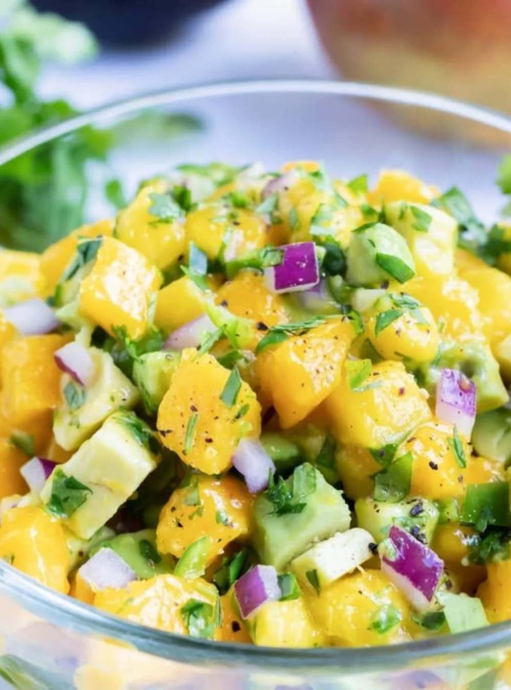 Delicious Mango Avocado Salsa served in a bowl, showcasing fresh ingredients.