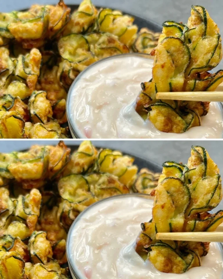 Crispy zucchini patties served on a plate, garnished with herbs.