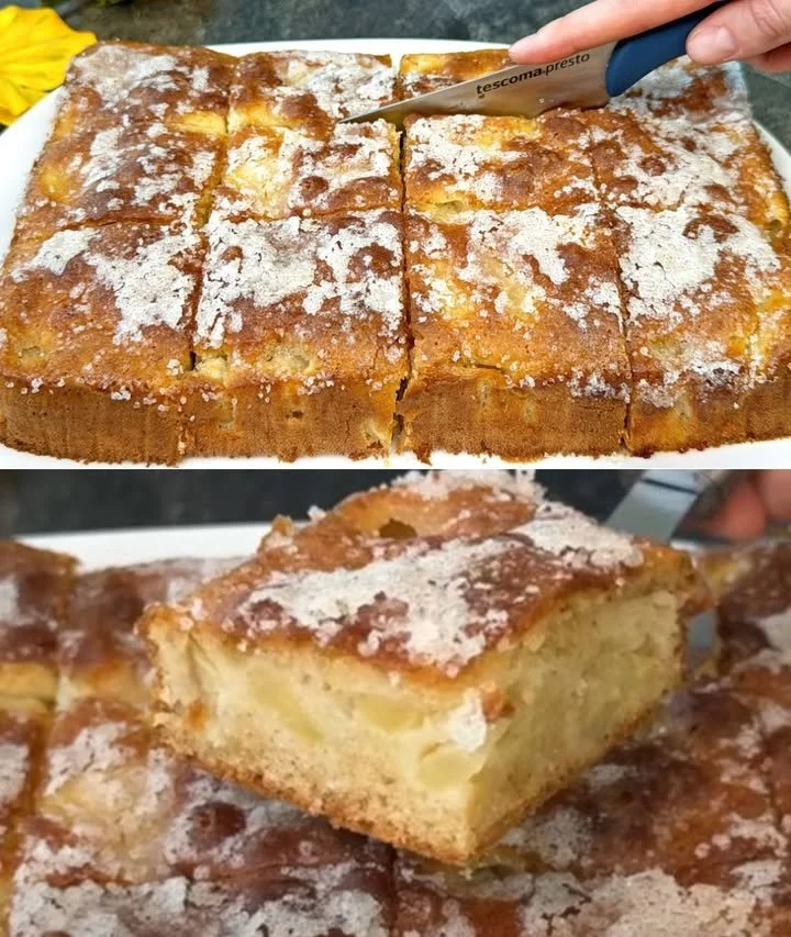 A freshly baked apple cake served on a plate with cinnamon garnish.