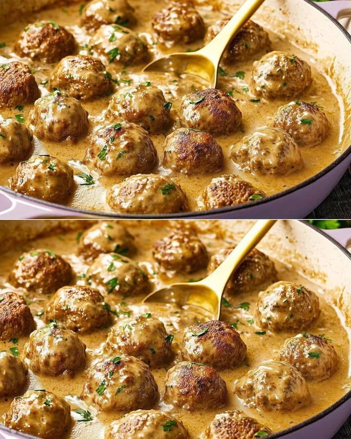 Plate of homemade Swedish meatballs with creamy sauce and herbs