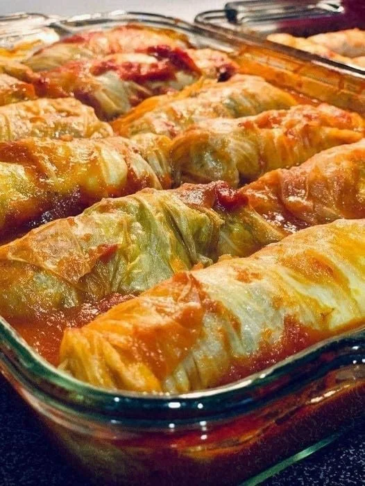 Plate of delicious stuffed cabbage rolls garnished with herbs